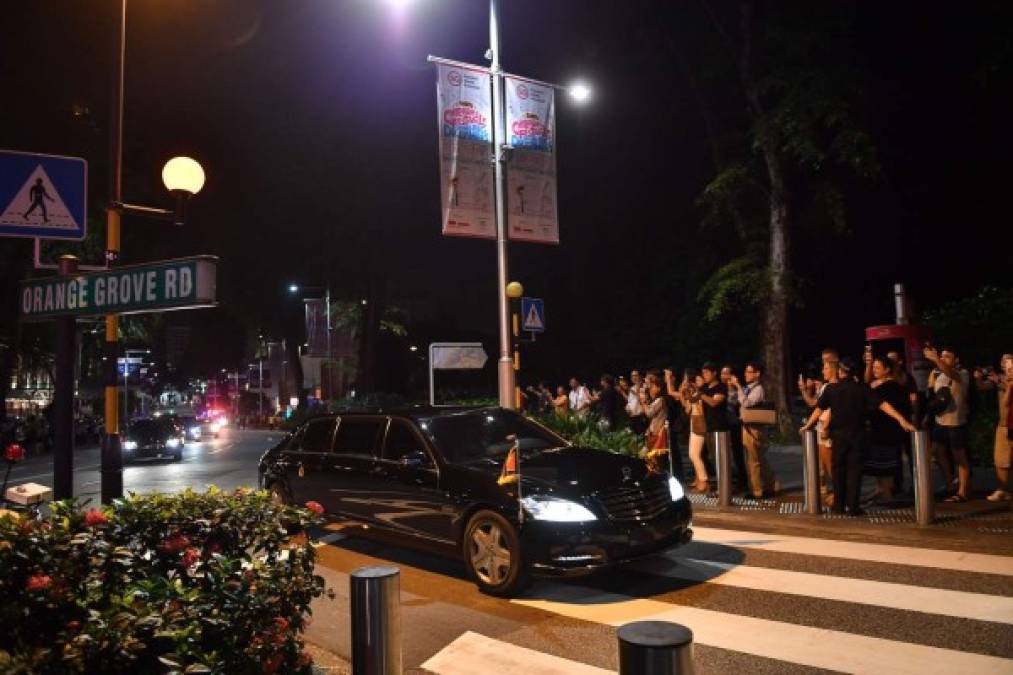 The convoy of North Korean leader Kim Jong Un are pictured on the road as they drive for his departure, in Singapore on June 12, 2018.<br/>Donald Trump and Kim Jong Un became on June 12 the first sitting US and North Korean leaders to meet, shake hands and negotiate to end a decades-old nuclear stand-off. / AFP PHOTO / ADEK BERRY