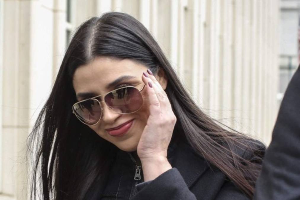 (FILES) In this file photo Emma Coronel Aispuro,(C) wife of Joaquin 'El Chapo' Guzman leaves from the US Federal Courthouse after a verdict was announced at the trial for Joaquin 'El Chapo' Guzman on February 12, 2019 in Brooklyn, New York. - US authorities arrested the wife of jailed Mexican drug lord Joaquin 'El Chapo' Guzman Loera February 22 as she arrived at Dulles International Airport outside of Washington, the Justice Department said.<br/>Emma Coronel Aispuro, 31, faces charges of conspiracy to traffick cocaine, methamphetamine, heroin and marijuana for importation into the United States, it said. (Photo by KENA BETANCUR / AFP)
