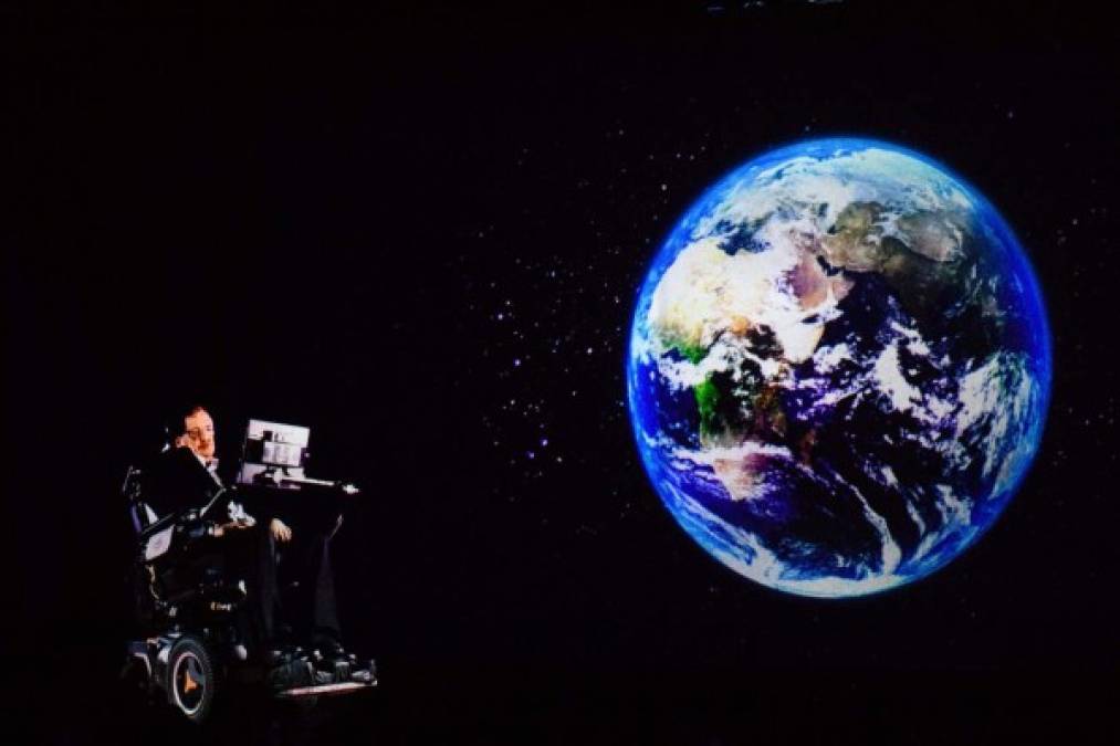 (FILES) In this file photo taken on March 24, 2017, renowned physicist Stephen Hawking, 75, speaks to an audience by hologram (L) in Hong Kong, beamed live from his office in Cambridge, England.<br/>Renowned British physicist Stephen Hawking has died at age 76, a family spokesman said Wednesday, March 14, 2018. We are deeply saddened that our beloved father passed away today,' professor Hawking's children, Lucy, Robert, and Tim said in a statement carried by Britain's Press Association news agency. 'He was a great scientist and an extraordinary man whose work and legacy will live on for many years.'<br/> / AFP PHOTO / Anthony WALLACE