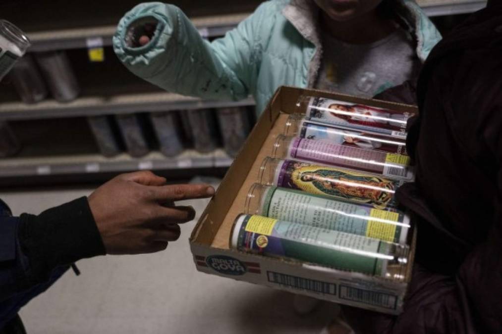 HOUSTON, TX - FEBRUARY 16: People shop for candles in Fiesta supermarket on February 16, 2021 in Houston, Texas. Winter storm Uri has brought historic cold weather, power outages and traffic accidents to Texas as storms have swept across 26 states with a mix of freezing temperatures and precipitation. Go Nakamura/Getty Images/AFP<br/><br/>== FOR NEWSPAPERS, INTERNET, TELCOS & TELEVISION USE ONLY ==<br/><br/>