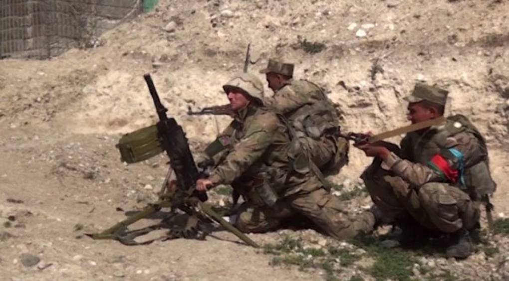 An image grab taken from a video made available on the official web site of the Azerbaijani Defence Ministry on September 28, 2020, allegedly shows Azeri troops conducting a combat operation during clashes between Armenian separatists and Azerbaijan in the breakaway region of Nagorno-Karabakh. (Photo by Handout / Azerbaijani Defence Ministry / AFP) / RESTRICTED TO EDITORIAL USE - MANDATORY CREDIT 'AFP PHOTO / Azerbaijani Defence Ministry' - NO MARKETING NO ADVERTISING CAMPAIGNS - DISTRIBUTED AS A SERVICE TO CLIENTS --- NO ARCHIVE ---