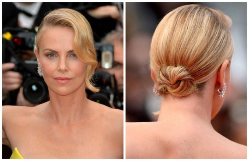 La actriz Charlize Theron con maquillaje monocromático, cabello ondulado y la melena recogida.