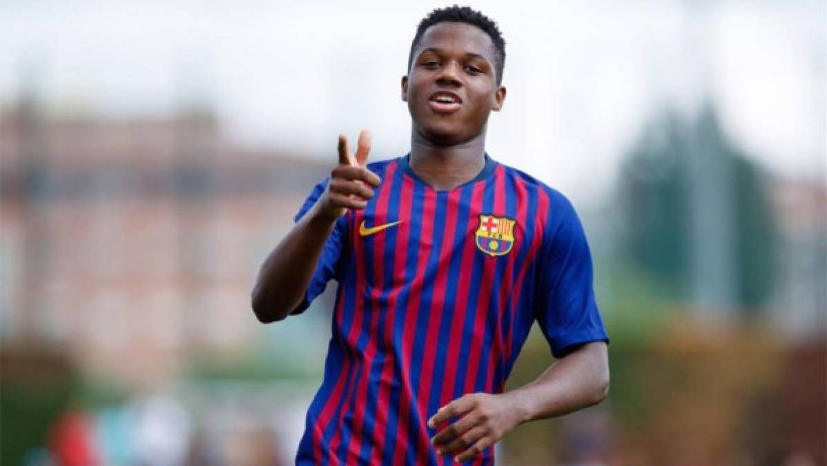 Barcelona's Spanish midfielder Ansu Fati (TOP) celebrates scoring his team's third goal during the Spanish League football match between FC Barcelona and Levante UD at the Camp Nou stadium in Barcelona on September 26, 2021. (Photo by LLUIS GENE / AFP)