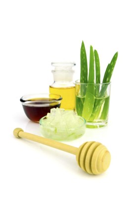 Aloe vera hair and facial treatment paste mask ingredients on white background.