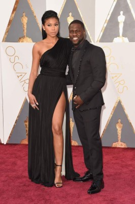 HOLLYWOOD, CA - FEBRUARY 28: Actor Kevin Hart (R) and Eniko Parrish attends the 88th Annual Academy Awards at Hollywood & Highland Center on February 28, 2016 in Hollywood, California. Jason Merritt/Getty Images/AFP== FOR NEWSPAPERS, INTERNET, TELCOS & TELEVISION USE ONLY ==