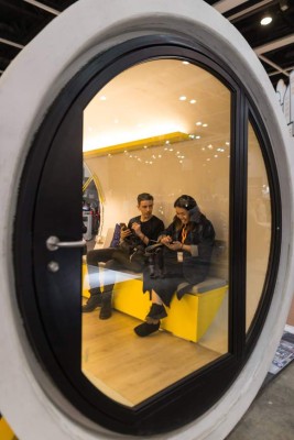 HONG KONG WATER PIPE HOME-04. Hong Kong (China), 07/12/2017.- Visitors sit inside the OPod Tube House on display during the Design Inspire exhibition in Hong Kong, China, 07 December 2017 (issued 10 December 2017). The OPod Tube House, created by James Law Cybertecture, is an experimental low cost, micro-living housing unit constructed out of a 2.5 meters diameter concrete water pipe that aims to ease Hong Kong's affordable housing problem. EFE/EPA/JEROME FAVRE