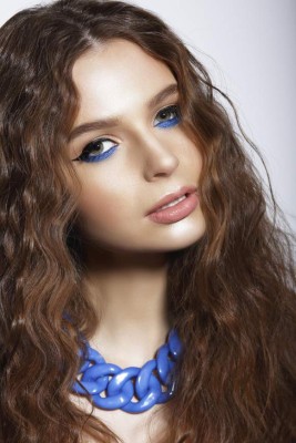 Portrait of Young Woman with Trendy Vivid Makeup