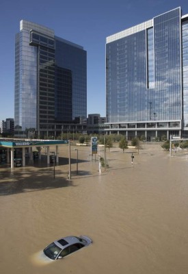 HOUSTON, TX - AUGUST 30: A car sits submerged on the I-10 East Frontage Road in the Energy Corridor of west Houston, Texas where families were rescued from their flooded homes and apartments due to high water coming from the Addicks Reservoir after Hurricane Harvey on August 30, 2017 in Houston, Texas. Harvey, which made landfall north of Corpus Christi August 25, has dumped more than 50 inches of rain in some areas in and around Houston. Erich Schlegel/Getty Images/AFP== FOR NEWSPAPERS, INTERNET, TELCOS & TELEVISION USE ONLY ==