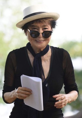 (FILES) This file photo taken on July 29, 2015 shows Yoko Ono looking on during a dedication ceremony for a giant tapestry, from Amnesty International, in honor of John Lennon on Ellis Island in New York.Nearly half a century after John Lennon released 'Imagine,' his widow and artistic collaborator Yoko Ono will be listed as a co-writer. The announcement was made as the iconic 1971 ode to world peace was declared 'song of the century' at a gala June 14, 2017 in New York of the National Music Publishers Association. / AFP PHOTO / Don EMMERT