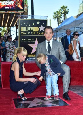 (FILES) This file photo taken on April 21, 2017 shows actor Chris Pratt with his wife, actress Anna Faris, and son pose on Pratt's Hollywood Walk of Fame Star in Hollywood, California.Pratt and Faris announced their separation after eight years of marriage in a joint statement on August 6, 2017. The couple, whose son Jack turns five this month, said they were 'disappointed' to be making the announcement after trying 'for a long time' to save their relationship. / AFP PHOTO / FREDERIC J. BROWN