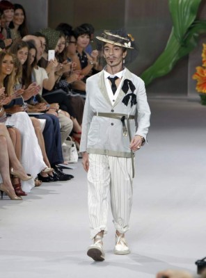 British fashion designer John Galliano acknowledges applause at the end of the presentation of his Fall-Winter 2010-2011 Haute Couture collection, for French fashion house Christian Dior in Paris, Monday July 5, 2010.(AP Photo/Remy de la Mauviniere)
