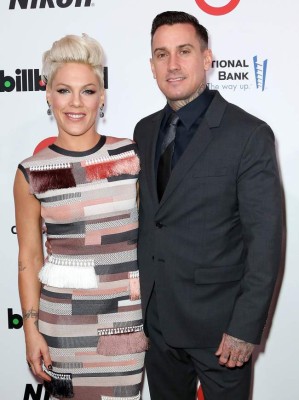 NEW YORK, NY - DECEMBER 10: (L-R) Singer-songwriter P!nk and motorcycle racer Carey Hart attend the 2013 Billboard Annual Women in Music Event at Capitale on December 10, 2013 in New York City. (Photo by Monica Schipper/FilmMagic)