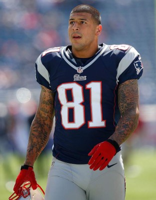 (FILES) This file photo taken on September 15, 2012 shows Aaron Hernandez #81 of the New England Patriots practicing before a game against the Arizona Cardinals at Gillette Stadium in Foxboro, Massachusetts. Former American football star Aaron Hernandez on April 19, 2017 was found dead in prison where he was serving a life sentence for murder, after hanging himself with a bedsheet, prison officials said. Hernandez, 27, was discovered hanging in his cell by corrections officers in Shirley, Massachusetts at approximately 3:05 am (0705 GMT) Wednesday, Christopher Fallon with the Massachusetts Department of Correction said.'Mr. Hernandez hanged himself utilizing a bedsheet that he attached to his cell window,' Fallon's statement said. / AFP PHOTO / GETTY IMAGES NORTH AMERICA / Jim Rogash
