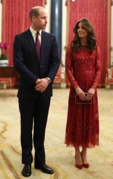 Britain's Prince William, Duke of Cambridge (L) and Britain's Catherine, Duchess of Cambridge (R) host a reception for heads of State and Government at Buckingham Palace in London on January 20, 2020, following the UK-Africa Investment Summit. (Photo by Yui Mok / POOL / AFP)