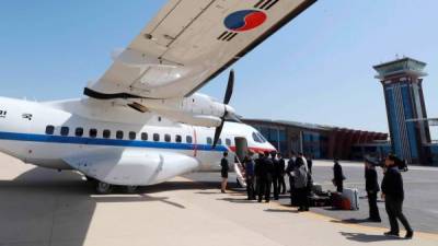 Periodistas surcoreanos comenzaron a llegar este miércoles a Corea del Norte para presenciar el desmantelamiento del centro nuclear de Kim Jong-un./AFP.