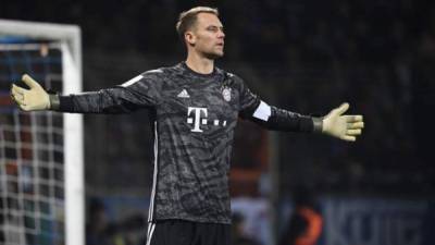 (FILES) In this file photo taken on October 29, 2019 Bayern Munich's German goalkeeper Manuel Neuer reacts during the German Cup (DFB Pokal) second round football match VfL Bochum v FC Bayern Munich in Bochum, western Germany. - Manuel Neuer has extended his contract with the club until 2023 it was announced on May 20, 2020. (Photo by INA FASSBENDER / AFP)