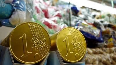 Chocolate Euro coins are displayed on a stand at Piazza Navona in central Rome, on December 30, 2010. The euro will celebrate its 10th anniversary on January 1, 2012. AFP PHOTO / ANDREAS SOLARO