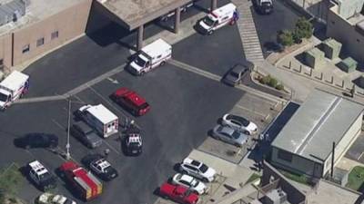 (FILES) In this file photo taken on July 29, 2019, a police officer leaves the scene of the investigation following a deadly shooting at the Gilroy Garlic Festival in Gilroy, 80 miles south of San Francisco, California. - The FBI has opened a domestic terrorism investigation into the mass shooting in Gilroy after finding evidence of 'violent ideologies' on the gunman's digital devices, officials said August 6, 2019. Santino William Legan killed three people including two children at the festival. (Photo by Philip Pacheco / AFP)