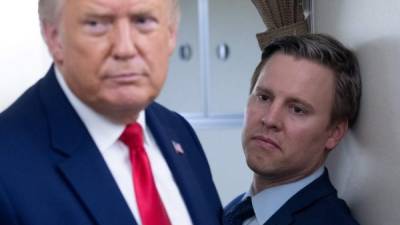 (FILES) In this file photo Campaign manager Bill Stepien stands alongside US President Donald Trump as he speaks with reporters aboard Air Force One as he flies from Manchester, New Hampshire to Joint Base Andrews in Maryland, August 28, 2020, following a campaign rally. - President Donald Trump's campaign said November 4, 2020 it was demanding a recount in Wisconsin, where early returns show Democrat Joe Biden with a slender lead. 'There have been reports of irregularities in several Wisconsin counties which raise serious doubts about the validity of the results,' campaign manager Bill Stepien said in a statement. 'The president is well within the threshold to request a recount and we will immediately do so.' (Photo by SAUL LOEB / AFP)