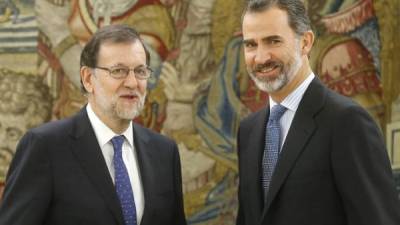 Mariano Rajoy, que juró ayer como presidente del Gobierno español, junto con el rey Felipe VI. Foto: EFE/Ángel Díaz