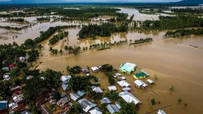 Inundaciones sepultaron unos cuarenta hogares en la ciudad de Piagapo, donde murieron al menos 10 personas. AFP