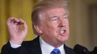 US President Donald Trump speaks before signing the Economic Growth, Regulatory Relief, and Consumer Protection Act in the Roosevelt Room at the White House in Washington, DC, on May 24, 2018.Donald Trump's decision to cancel a June 12 summit with North Korea's Kim Jong Un is the latest dramatic twist in relations between two leaders who traded insults before laying the groundwork for what would have been a stunning rapprochement. / AFP PHOTO / NICHOLAS KAMM