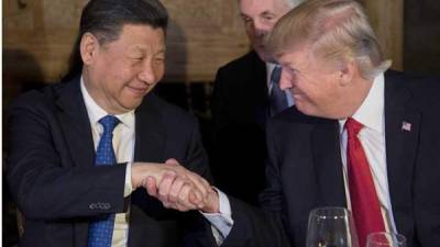 Xi Jinping, presidente de China, con su homólogo estadounidense Donald Trump.
