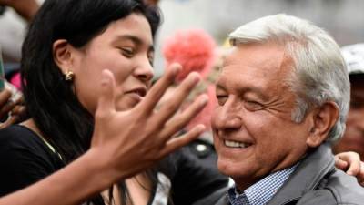 Mexican President Andres Manuel Lopez Obrador (R) and his wife Betriz Gutierrez show their thumbs after voting in Mexico City, on June 6, 2021. - Mexicans began voting Sunday in elections seen as pivotal to President Andres Manuel Lopez Obrador's promised 'transformation' of a country shaken by the coronavirus pandemic, a deep recession and drug-related violence. (Photo by ALFREDO ESTRELLA / AFP)