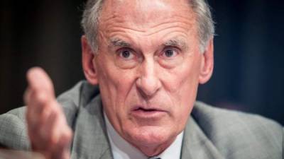(FILES) In this file photo taken on February 13, 2018 Director of National Intelligence Dan Coats testifies on worldwide threats during a Senate Intelligence Committee hearing on Capitol Hill in Washington, DC.The threat of cyberattacks against the US is at a 'critical point,' the country's intelligence chief has warned, branding Russia the most 'aggressive foreign actor' ahead of President Donald Trump's meeting with Vladimir Putin. 'The warning signs are there. The system is blinking. It is why I believe we are at a critical point,' national intelligence director Dan Coats said July 13, 2018 at an event in Washington. / AFP PHOTO / SAUL LOEB