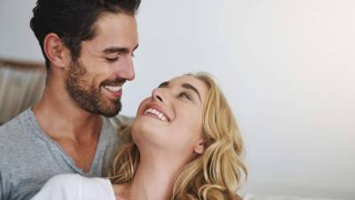 Shot of a young couple relaxing at home