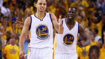 PORTLAND, OREGON - MAY 20: Stephen Curry #30 of the Golden State Warriors high fives Draymond Green #23 during the second half against the Portland Trail Blazers in game four of the NBA Western Conference Finals at Moda Center on May 20, 2019 in Portland, Oregon. NOTE TO USER: User expressly acknowledges and agrees that, by downloading and or using this photograph, User is consenting to the terms and conditions of the Getty Images License Agreement. Steve Dykes/Getty Images/AFP