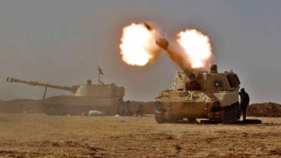 Fuerzas iraquíes combaten en Tall al-Tibah, unos 30 kilómetros al sur de Mosul. Fotos: AFP