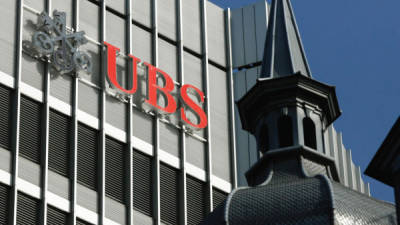 (FILES) In this file photo taken on January 22, 2018 shows the UBS logo in Zurich. - After a six-year investigation, judges last year charged the bank and its French subsidiary of laundering proceeds from tax fraud carried out from 2004 to 2012, allegations the bank has denied. Paris courthouse will rule on the case fo the Swiss giant bank UBS on the afternoon of February 20, 2019. (Photo by MICHELE LIMINA / AFP)