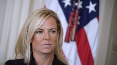 (FILES) In this file photo taken on October 12, 2017, Kirstjen Nielsen listens as US President Donald Trump nominates her as next US Secretary of Homeland Security in the East Room of the White House in Washington, DC. - US President Donald Trump on Sunday, April 7, 2019 announced Homeland Security Secretary Kirstjen Nielsen, the front-line defender of the administration's controversial immigration policies, would leave her position. 'Secretary of Homeland Security Kirstjen Nielsen will be leaving her position, and I would like to thank her for her service,' Trump tweeted. (Photo by Mandel NGAN / AFP)