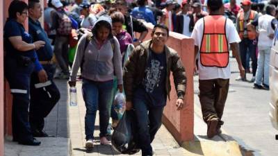 Central American migrants taking part in the 'Migrant Via Crucis' caravan which originally planned to reach the US border, arrive at the Casa del Peregrino shelter near the Guadalupe Basilica in Mexico City on April 9, 2018.The caravan, an annual event held since 2010 and which prompted fury from US President Donald Trump, assembled on the border with Guatemala on March 25 but started breaking up on Thursday in southern Mexico after organizers said it had abandoned its goal of reaching the US border and would end its activities with the rally in Mexico City. / AFP PHOTO