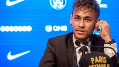 Handout picture released by the Brazilian Football Confederation (CBF) showing Brazilian football star Neymar, who is to make his 100th appearance with the national team in a friendly match against Senegal, speaking during a press conference in Singapore on October 9, 2019. - Brazil will face Senegal on October 10 and Nigeria on October 13 in two friendly matches in Singapore. (Photo by Lucas FIGUEIREDO / Brazilian Football Confederation (CBF) / AFP) / RESTRICTED TO EDITORIAL USE - MANDATORY CREDIT 'AFP PHOTO / CBF / LUCAS FIGUEIREDO' - NO MARKETING - NO ADVERTISING CAMPAIGNS - DISTRIBUTED AS A SERVICE TO CLIENTS