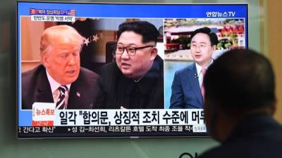 El encuentro entre Trump y Kim está previsto el martes en un lujoso hotel de la ciudad Estado. / AFP PHOTO / Jung Yeon-je