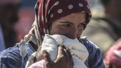 Una madre lamenta los atentados terroristas ocurridos en Siria.