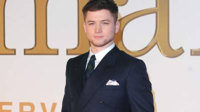 British actor Taron Egerton poses on the red carpet upon arrival at the BAFTA British Academy Film Awards at the Royal Albert Hall in London on February 2, 2020. (Photo by Tolga AKMEN / AFP)