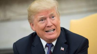 epa06276452 US President Donald J. Trump speaks to the media during a meeting with Governor Ricardo Rossello (not pictured) of Puerto Rico during a meeting in the Oval Office at the White House, in Washington, D.C., USA, 19 October 2017. EPA/KEVIN DIETSCH / POOL