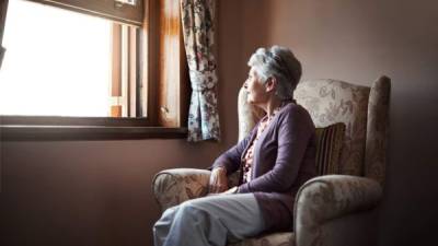 Shot of a senior woman sitting alone in her living room