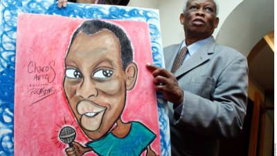 El reconocido cantante y actor Johnny Laboriel con una caricatura.