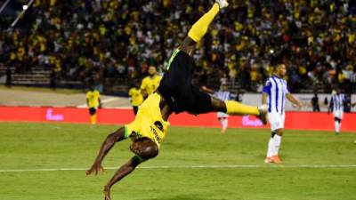 Jamaica's Dever Orgill does a flip as he celebrates after scoring a goal during the 2019 Concacaf Gold Cup match between Jamaica and Honduras, on June 17, 2019 at Independence Park in Kingston. (Photo by CHANDAN KHANNA / AFP)