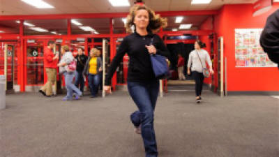 A customer jogs in to Target for the Black Thursday sale in Marion, Ill. on Thursday, Nov. 22, 2012. (AP Photo/The Southern, Joel Hawksley)