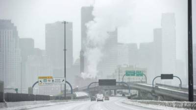 Ice and snow cover Interstate 93 through the city during Winter Storm Harper in Boston, Massachusetts on January 20, 2019. (Photo by Joseph PREZIOSO / AFP)