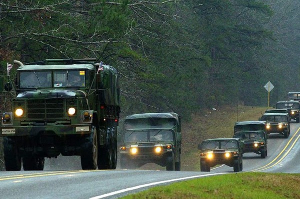 California National Guard armed vehicules are seen on the freeway as they patrol after demonstrators protested the death of George Floyd in Los Angeles, California on May 31, 2020. - Thousands of National Guard troops patrolled major US cities after five consecutive nights of protests over racism and police brutality that boiled over into arson and looting, sending shock waves through the country. The death Monday of an unarmed black man, George Floyd, at the hands of police in Minneapolis ignited this latest wave of outrage in the US over law enforcement's repeated use of lethal force against African Americans -- this one like others before captured on cellphone video. (Photo by Agustin PAULLIER / AFP) (Photo by AGUSTIN PAULLIER/AFP via Getty Images)