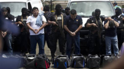 Nicaragua National Police present 18 foreigners believed to be Mexican nationals who posed as Televisa journalists, in Managua, Nicaragua, Friday, Aug. 24, 2012. Police Commissioner Aminta Granera said the men posed as Televisa journalists to cover the trial of Nicaraguan businessman Henry Fariñas, survivor of an attack that killed the singer Facundo Cabral last year. The Mexican ambassador to Nicaragua confirmed that the Mexican news channel has no correspondents in Nicaragua. It is unclear why the men were posing as journalists. (AP Photo/Esteban Felix)