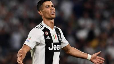Juventus' Portuguese forward Cristiano Ronaldo reacts during the Italian Serie A football match Juventus vs Napoli on September 29, 2018 at the Juventus stadium in Turin. / AFP PHOTO / Marco BERTORELLO