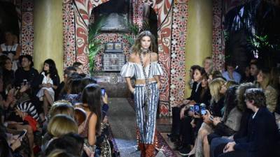 A model presents a creation for fashion house Roberto Cavalli during the 2017 Women's Spring / Summer collections shows at Milan Fashion Week on September 21, 2016 in Milan.