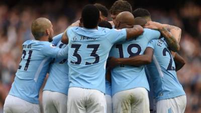 Manchester City players celebrate after Manchester City's German midfielder Leroy Sane scored their sixth goal during the English Premier League football match between Manchester City and Stoke City at the Etihad Stadium in Manchester, north west England, on October 14, 2017. / AFP PHOTO / Oli SCARFF / RESTRICTED TO EDITORIAL USE. No use with unauthorized audio, video, data, fixture lists, club/league logos or 'live' services. Online in-match use limited to 75 images, no video emulation. No use in betting, games or single club/league/player publications. /